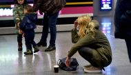 A women reacts at the arrival gate of the Boryspil airport outside Kiev on January 8, 2020. AFP / Sergei Supinsky 