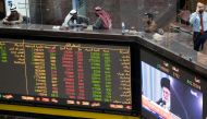 Iran's Supreme Leader Ayatollah Ali Khamenei is seen speaking on a TV screen in the Kuwait Bourse (Stock Exchange), as investors sit and monitor the shares in Kuwait City, Kuwait. January 8, 2020. Reuters/Stephanie McGehee 