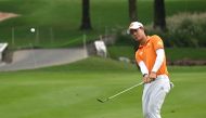 (FILES) This file photo taken on December 15, 2019 shows Jazz Janewattananond of Thailand chipping onto the 17th green during the final round of the BNI Indonesian Masters golf tournament at the Royale Jakarta Golf Club in Jakarta. AFP / GOH CHAI HIN