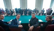 Austrian Chancellor Sebastian Kurz (C-L) and Vice Chancellor Werner Kogler (C-R) have taken seat to attend the first Council of Ministers of Austria's new government coalition of conservatives and Greens in Vienna on January 8, 2020. AFP / Alex Halada
 