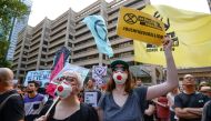Protesters hold placards during a climate change rally in Sydney, Australia, January 10, 2020. AAP Image/Paul Braven/via REUTERS 