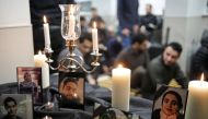 Photographs of student victims of a Ukrainian passenger jet which crashed in Iran are seen during a vigil at University of Toronto student housing in Toronto, Ontario, Canada January 8, 2020. Reuters/Chris Helgren