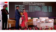 Hameeda Kadar, Principal of MES Indian School receiving the award.