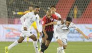 The players of Al Sadd and Al Rayyan vie for ball possession during the Qatar Cup semi-final match at Al Sadd Stadium yesterday.