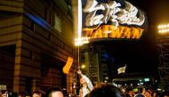 Supporters celebrate the poll victory of Taiwan's President Tsai Ing-wen and chant slogans in support of pro-democracy protesters in Hong Kong, outside the Democratic Progressive Party's headquarters as results came in for the general election in Taipei o