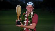 HONOLULU, HAWAII - JANUARY 12: Cameron Smith of Australia celebrates with the winner's trophy after the final round of the Sony Open in Hawaii at the Waialae Country Club on January 12, 2020 in Honolulu, Hawaii. Harry How/AFP
