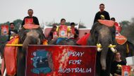 Students and a troupe of ten elephants pray for Australia bushfires, in Ayutthaya, Thailand January 13, 2020. REUTERS/Soe Zeya Tun