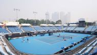 A general view is seen with the city skyline shrouded by smoke haze from bushfires during an Australian Open practice session at Melbourne Park in Melbourne, Australia, January 14, 2020. AAP Image/Michael Dodge/via REUTERS 