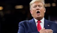 US President Donald Trump sings the National Anthem as he attends the College Football Playoff National Championship game at the Mercedes-Benz Superdome in New Orleans, Louisiana, January 13, 2020. / AFP / SAUL LOEB