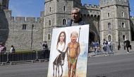 File photo: Artist Kaya Mar shows off his latest work in front of the castle in Windsor on May 17,  2018 two days before the royal wedding of Prince Harry and Meghan Markle. AFP / Adrian Dennis