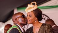 FILE PHOTO: Robert Mugabe kissing his wife Grace Mugabe during the 37th Independence Day celebrations at the National Sports Stadium in Harare on April 18, 2017. AFP / Jekesai Njikizana 