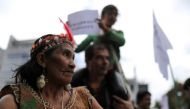 An indigenous woman looks on as she attends a protest outside the Brazilian embassy after the Amazon wildfires in in Bogota, Colombia, August 23, 2019. Reuters / Luisa Gonzalez