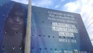 A poster warns of the dangers of false offers of work and child sexual exploitation, Puerto Maldonado, Peru. November 29, 2019. Thomson Reuters Foundation/Anastasia Moloney 