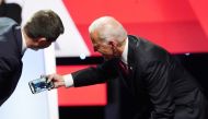 Pete Buttigieg leans in to a selfie by Joe Biden with the crowd at the end of the fourth US Democratic presidential candidates 2020 election debate at Otterbein University, October 15, 2019. Reuters /  Shannon Stapleton