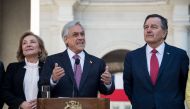 Chilean President Sebastian Pinera delivers a speech next to his wife Cecilia Morel and Chilean Minister of Foreign Affairs Roberto Ampuero on October 01, 2018. AFP / Martin Bernetti