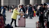 Passengers arrive at a train station in the city of Wuhan in Hubei province on January 12, 2020. AFP / Noel Celis