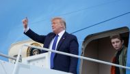 U.S. President Donald Trump and his son Barron step out from Air Force One upon arrival in West Palm Beach, Florida, U.S., January 17, 2020. REUTERS/Kevin Lamarque