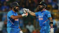 India's Virat Kohli (R) and Rohit Sharma greet each other during the third and last one day international (ODI) cricket match of a three-match series between India and Australia at the M. Chinnaswamy Stadium in Bangalore on January 19, 2020. AFP / Manjuna