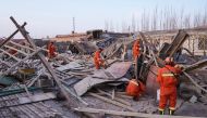 Rescuers search in the aftermath of an earthquake in Kashgar in China's northwestern Xinjiang region on January 20, 2020./ AFP / STR