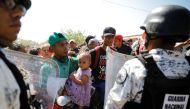 Members of Mexico's National Guard block migrants, part of a caravan travelling to the U.S., near the border between Guatemala and Mexico, in Ciudad Hidalgo, Mexico, January 20, 2020. Reuters/Jose Cabezas
 