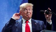  U.S. President Donald trump puts his hand to his head while speaking at the American Farm Bureau Federation Annual Convention and Trade Show in Austin, Texas, January 19, 2020. REUTERS/Kevin Lamarque 