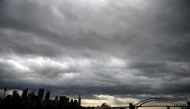 Storm clouds gather over Sydney Harbour on January 20, 2020.  AFP / Peter Parks 