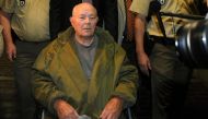 In this file photo taken on May 12, 2011 John Demjanjuk leaves the court after his verdict in Munich, southern Germany. AFP / Christof Stache 