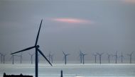 New Brighton lighthouse at the mouth of the river Mersey, in north-west England on May 14 2019 with the Burbo Bank Offshore Wind Farm visible on the horizon, on May 14, 2019. AFP / Paul Ellis 