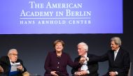 Former US Secretary of State Henry A. Kissinger, German Chancellor Angela Merkel, former president of Stanford University Gerhard Casper and former U.S. Secretary of State John Kerry attend the American Academy's award ceremony at the Charlottenburg Palac