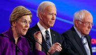 Elizabeth Warren speaks with Joe Biden and Bernie Sanders listening at the seventh Democratic 2020 presidential debate at Drake University in Des Moines, Iowa, US, January 14, 2020. Reuters/Shannon Stapleton