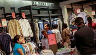  People shop for clothes during a seasonal sale at a store inside a shopping mall in Mumbai, India, July 14, 2012. Reuters/Danish Siddiqui