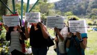 Women demonstrate during the funeral of Karla Turcios in San Salvador, El Salvador April 17, 2018. The signs read: 