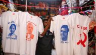 A worker displays T-shirts with images of Mamata Banerjee, Narendra Modi, Rahul Gandhi and logo of CPI-M for sale inside a shop in Kolkata, India, March 26, 2019. Reuters / Rupak De Chowdhuri