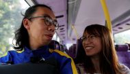 Derek Tai and his girlfriend Ann take a bus to a legal protest in Hong Kong, China, January 19, 2020. Reuters/Tyrone Siu
 