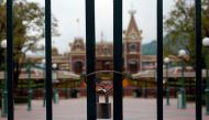 A locked gate is seen after the Hong Kong Disneyland theme park has been closed, following the coronavirus outbreak in Hong Kong, China January 26, 2020. REUTERS/Tyrone Siu