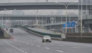 Cars are seen on a road on the first day of the Lunar New Year in Wuhan in China's central Hubei province on January 25, 2020, during a deadly virus outbreak which began in the city. AFP / Hector Retamal 
