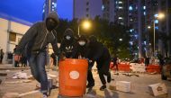 Residents set up barricades near the vacant Fai Ming Estate to protest against plans for the estate to be used as a quarantine camp for patients and frontline medical staff of a coronavirus outbreak which began in the Chinese city of Wuhan, in the Fanling