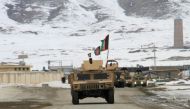 Afghan National Army forces go towards the site of an aeroplane crash in Deh Yak district of Ghazni province, Afghanistan January 27, 2020. REUTERS/Mustafa Andaleb