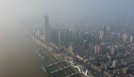 An aerial view shows residential and commercial buildings of Wuhan in China's central Hubei province on January 27, 2020, amid a deadly virus outbreak in the city. AFP / Hector RETAMAL