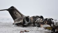 The wreckage of a US Bombardier E-11A jet is seen after it crashed in mountainous territory of Deh Yak district in Ghazni Province.   AFP 
