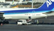 The first charter flight from the Chinese city of Wuhan, which was arranged by Japan's government to evacuate its citizens, lands at Haneda airport in Tokyo on January 29, 2020. A plane carrying Japanese nationals evacuated from Wuhan, the Chinese city at