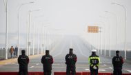 Police stand at a checkpoint at the Jiujiang Yangtze River Bridge that crosses from Hubei province in Jiujiang, Jiangxi province, China, as the country is hit by an outbreak of a new coronavirus, January 31, 2020