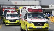 Ambulances carrying South Korean citizens repatriated from the Chinese city of Wuhan leave Gimpo airport in Seoul on January 31, 2020, following the arrival of the first charter flight arranged by South Korean government to evacuate its citizens from the 