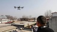 A representational image of a local resident using a drone to spray disinfectant at a village in Pingdingshan, in China's central Henan province on January 31, 2020, during the virus outbreak in Hubei's city of Wuhan. China OUT / AFP / STR
