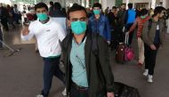 Pakistani students wearing protective facemasks come out upon their arrival from China at the Islamabad International Airport in Islamabad on February 3, 2020./ AFP / Aamir QURESHI
