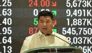 Dennis Uy, chairman and CEO of Philippines' Phoenix petroleum company, delivers his spech at the Philippine Stock Exchange in the financial district of Makati, suburban Manila on July 11, 2017, on the company's tenth anniversary of its listing.  Ted Aljib