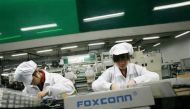 Employees work inside a Foxconn factory in the township of Longhua in the southern Guangdong province, China in this May 26, 2010 file photo. Reuters / Bobby Yip