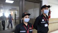 Security guards wearing protective facemasks keep vigil outside an isolation ward opened as a preventative measure following a SARS-like virus outbreak, at the Sardar Vallabhbhai Patel Institute of Medical Sciences in Ahmedabad on February 4, 2020. AFP / 