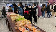 Indonesian citizens wait to be evacuated, ahead of departure to Indonesia at Tianhe International Airport, in Wuhan, Hubei, China February 1, 2020 in this photo taken by Antara Foto. Picture taken by February 1, 2020. Antara Foto/ via REUTERS 