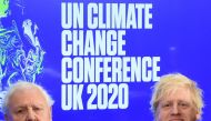 Britain's Prime Minister Boris Johnson (R) and British broadcaster and conservationist David Attenborough attend an event to launch the United Nations' Climate Change conference, COP26, in central London on February 4, 2020.  AFP / Jeremy Selwyn 